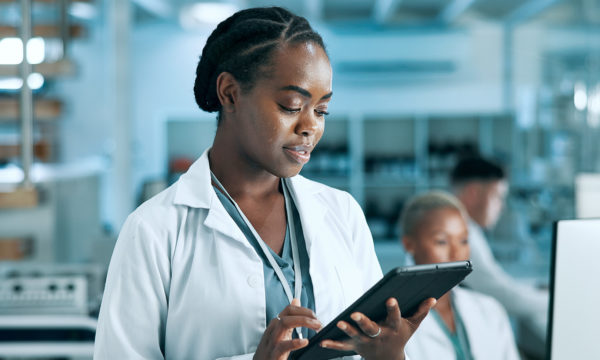 women on a tablet in a lab